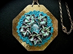 Picture of Brass pendant from polymer clay and glass.